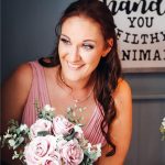 Bride holding bouquet smiling